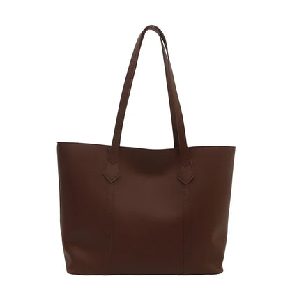 Elegant Women's Shoulder Bag with Sturdy Handles and Spacious Design