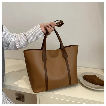 Elegant Women's Shoulder Bag with Sturdy Handles and Spacious Design