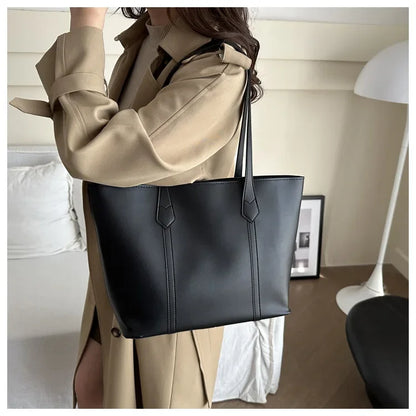 Elegant Women's Shoulder Bag with Sturdy Handles and Spacious Design