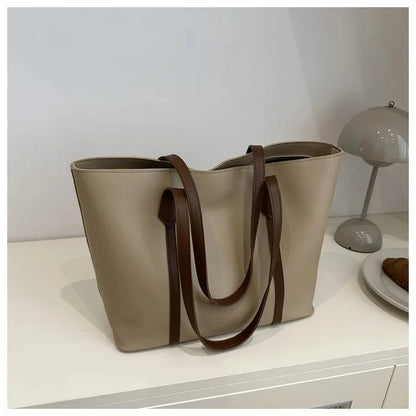 Elegant Women's Shoulder Bag with Sturdy Handles and Spacious Design