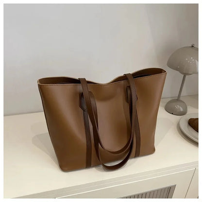 Elegant Women's Shoulder Bag with Sturdy Handles and Spacious Design