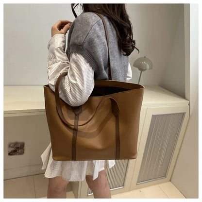Elegant Women's Shoulder Bag with Sturdy Handles and Spacious Design