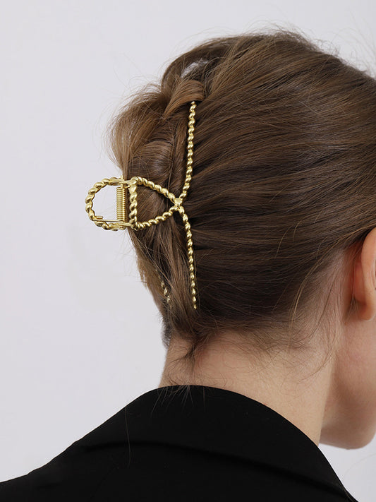Elegant Gold Women's Hair Clip with Subtle Twisted Look